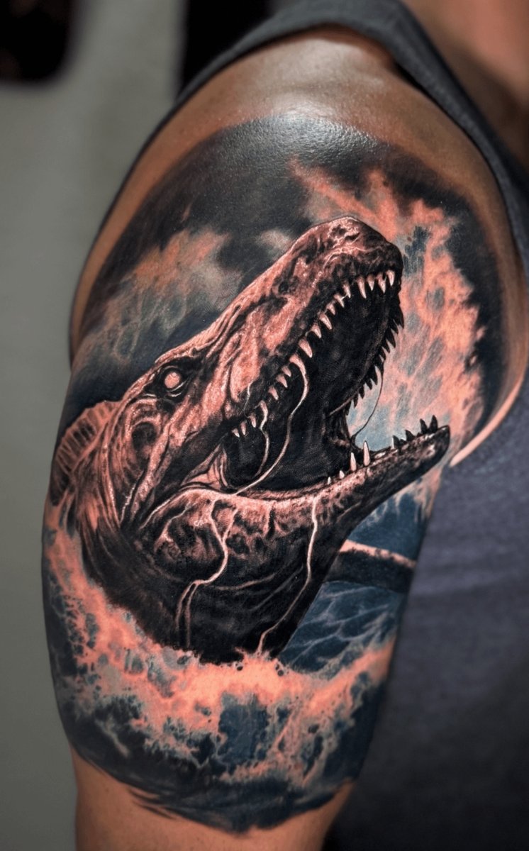 Photo of the tattoo titled Artistic Water Dinosaur Arm Piece