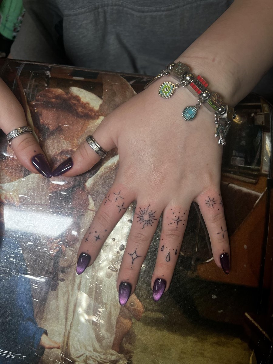 Photo of the tattoo titled Spontaneous Finger Ink Painful but Loved