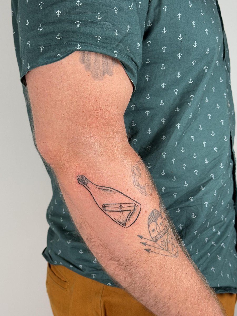 Photo of the tattoo titled Parisian Message in a Bottle