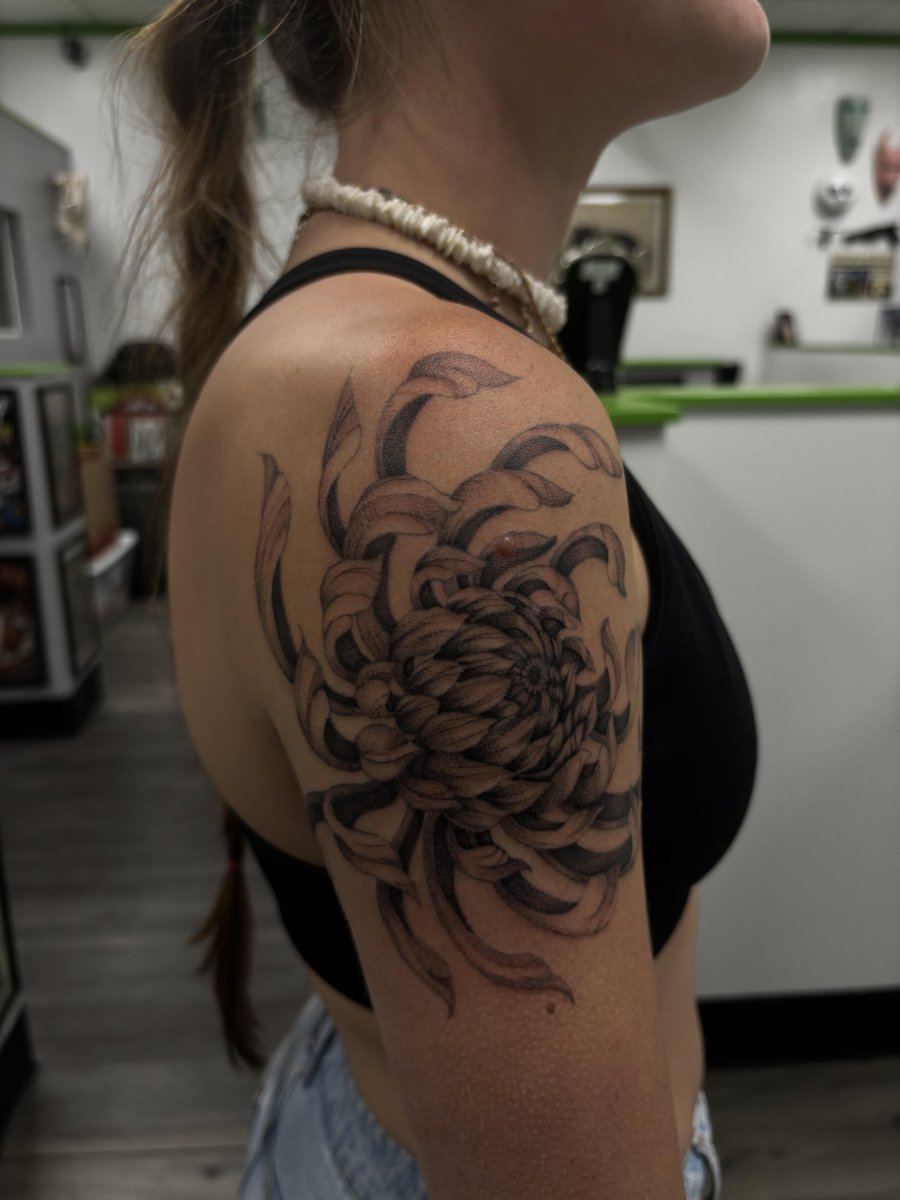 Photo of the tattoo titled Chrysanthemum Bloom of Resilience