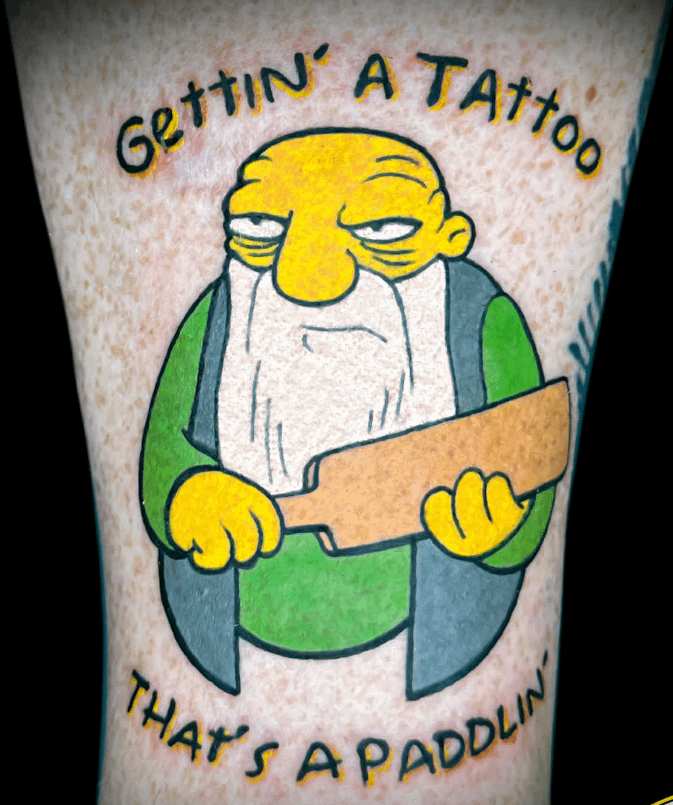 Photo of the tattoo titled That's a Paddlin'