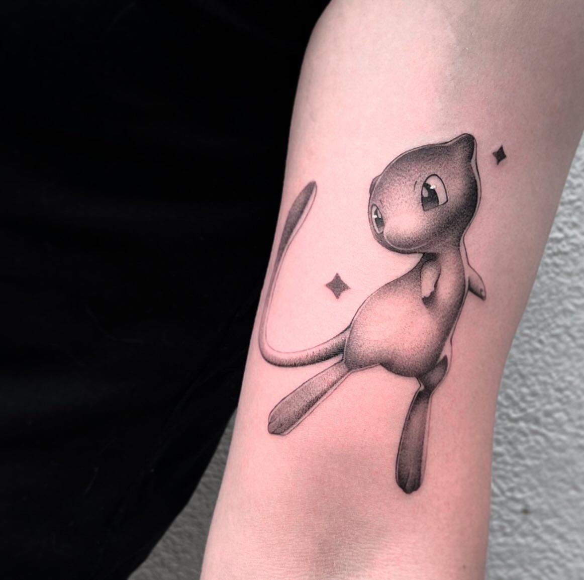Photo of the tattoo titled Playful Mew Pokémon ink