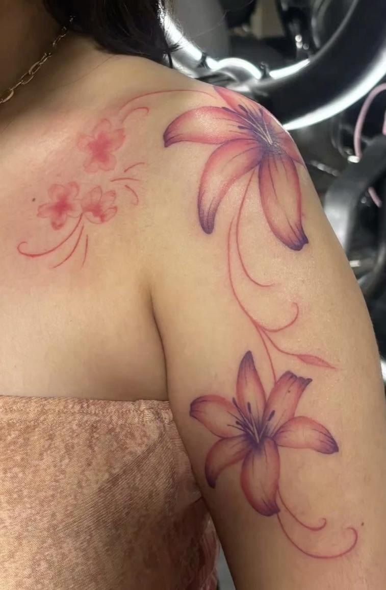 Photo of the tattoo titled First Tattoo: Red Ink Flower Advice