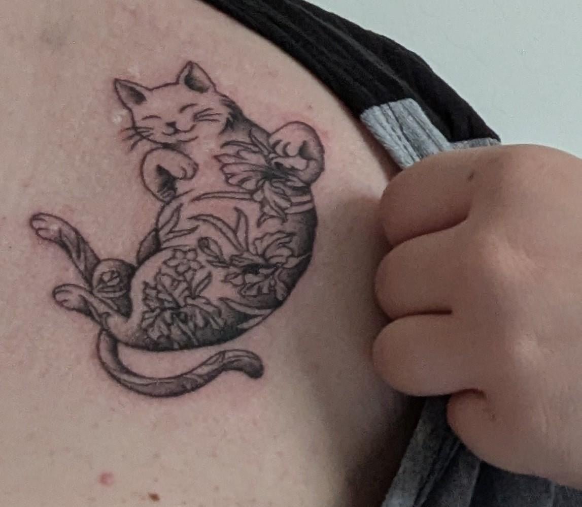 Photo of the tattoo titled Memorial Tattoo for Beloved Cat Iris