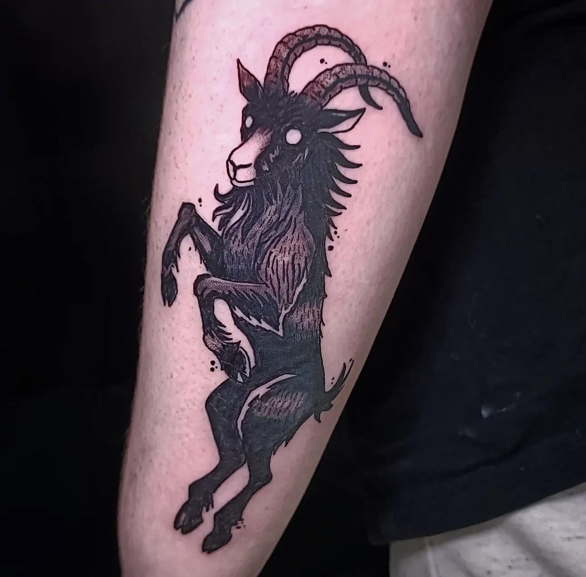 Photo of the tattoo titled My Black Philip Familiar
