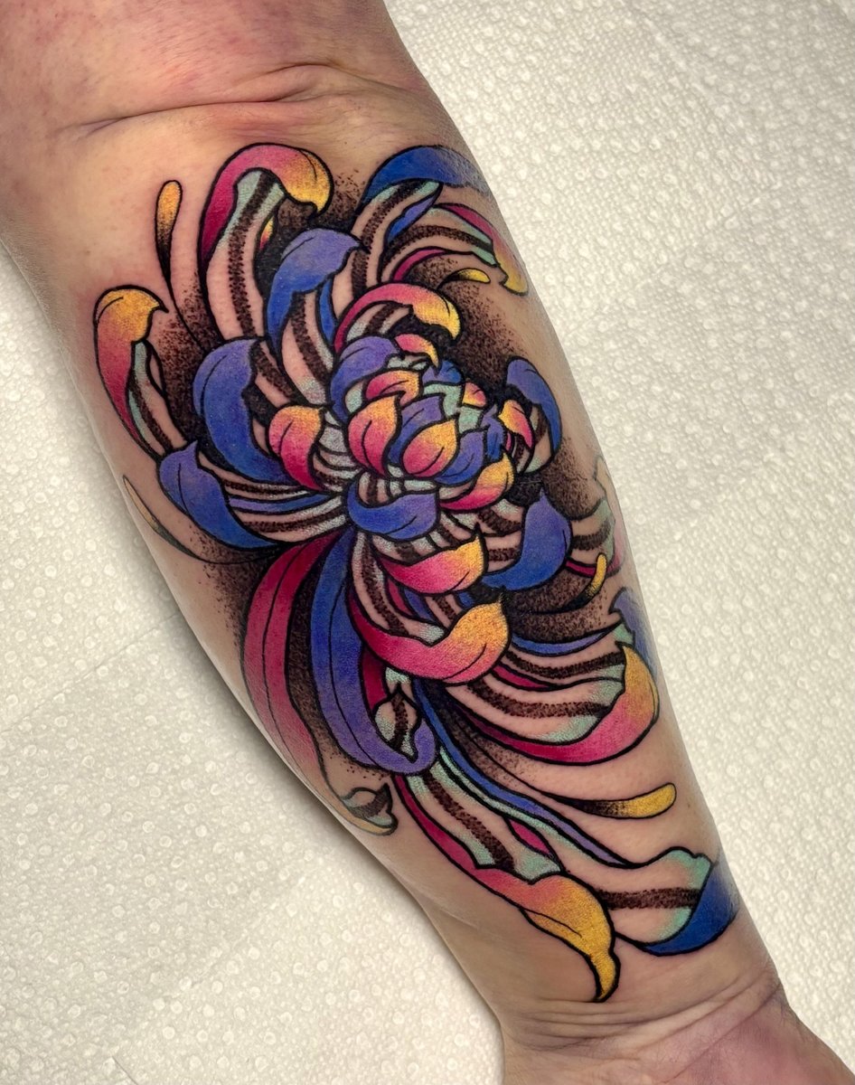 Photo of the tattoo titled Chrysanthemum: Symbol of Resilience