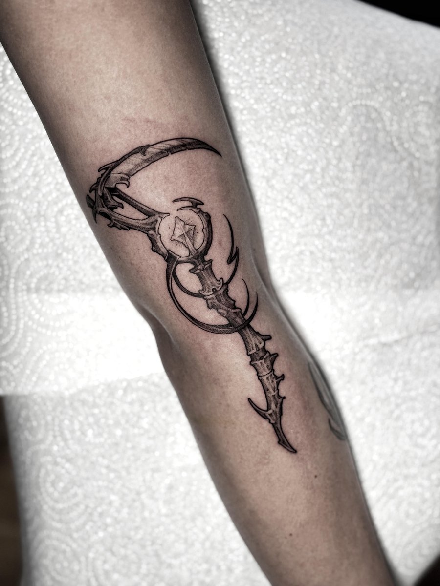 Photo of the tattoo titled Blackwork Illustrative Bone Scythe