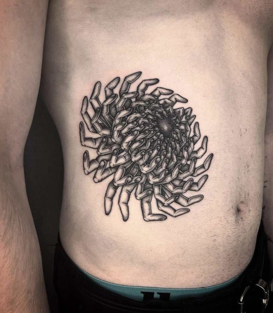Photo of the tattoo titled Chrysanthemum on the Ribs
