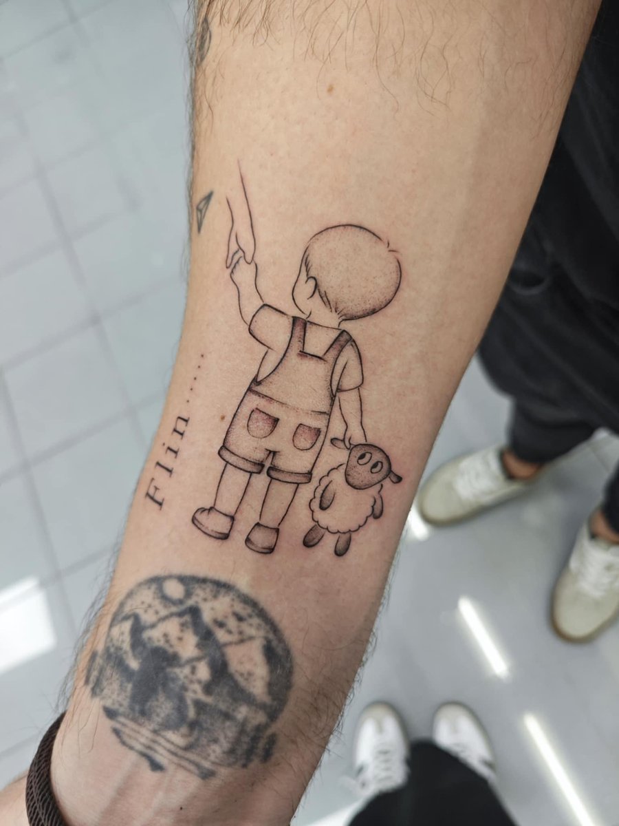 Photo of the tattoo titled My Little One's Sheep Companion