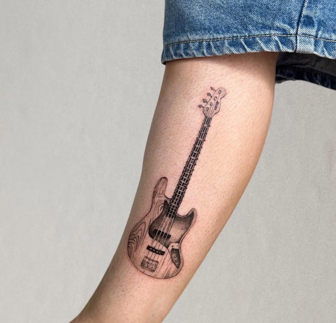 Photo of the tattoo titled Dad's Bass Guitar Keepsake