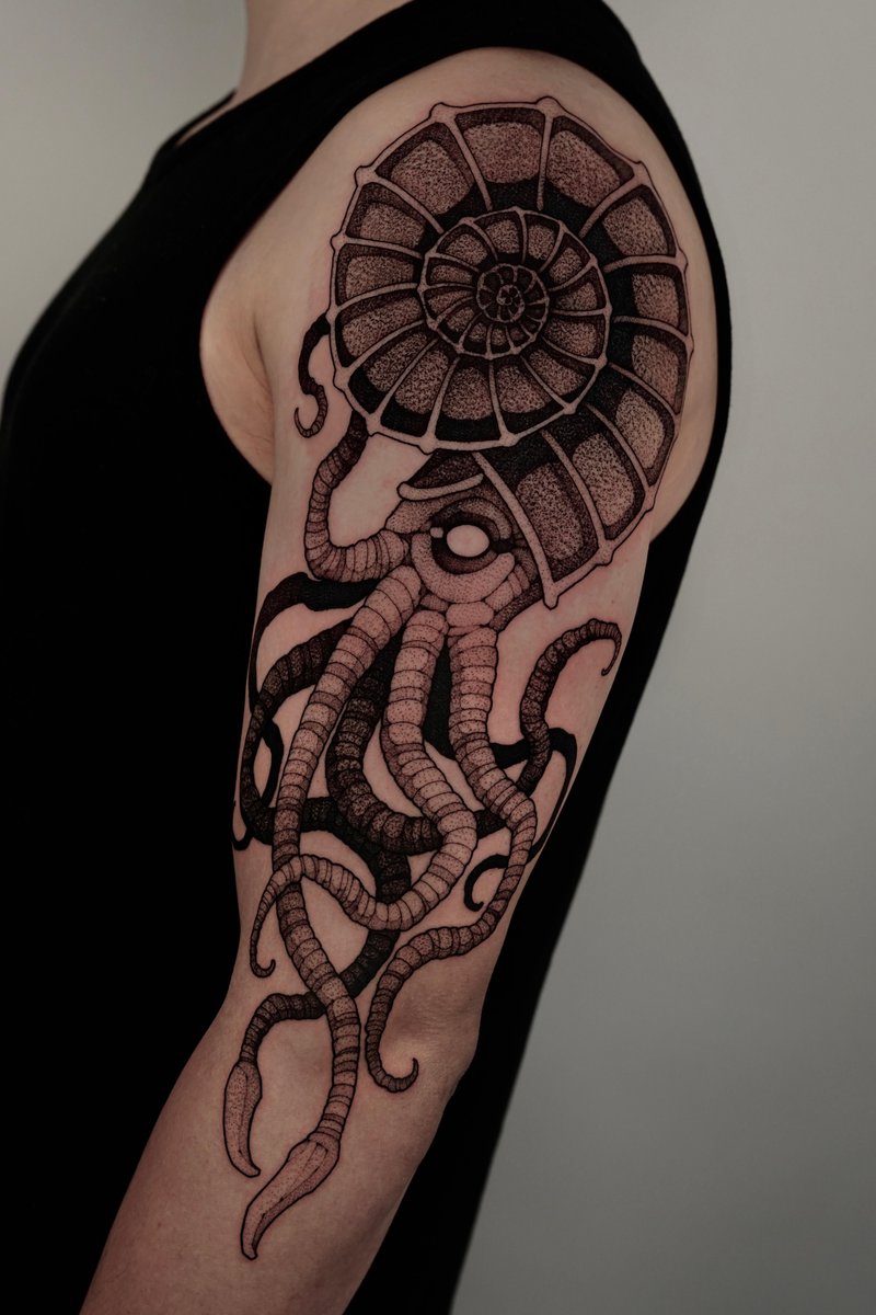 Photo of the tattoo titled Ammonite Fossil Tattoo