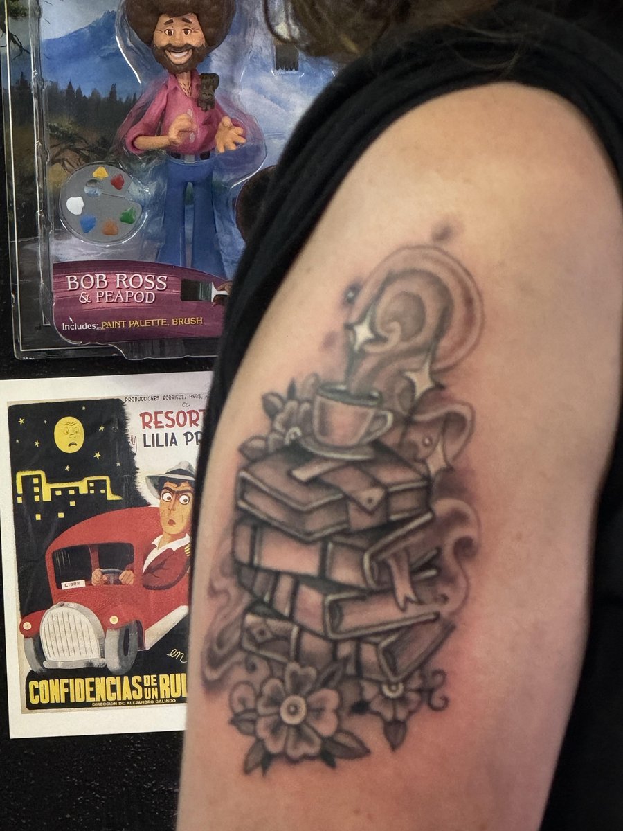 Photo of the tattoo titled Birthday surprise: Stack of books