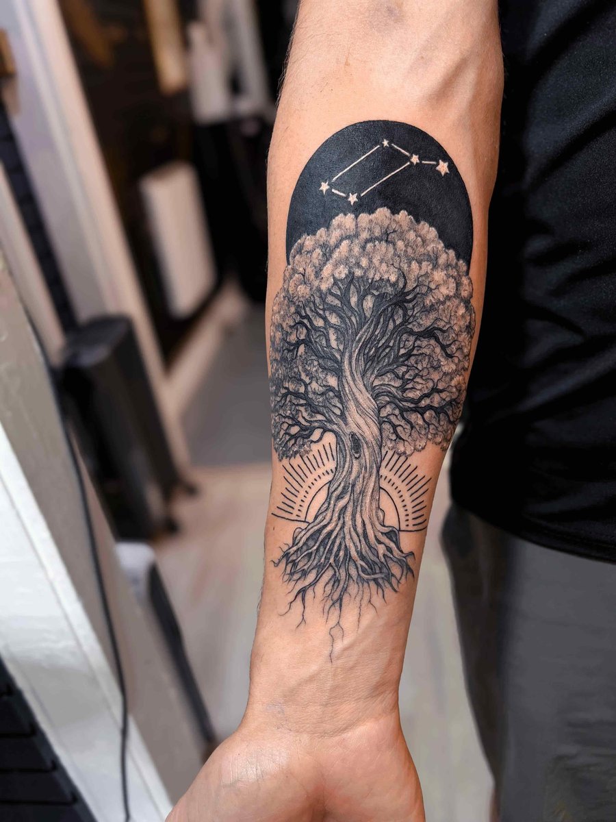 Photo of the tattoo titled Yggdrasil, Sun, and Lyra Constellation