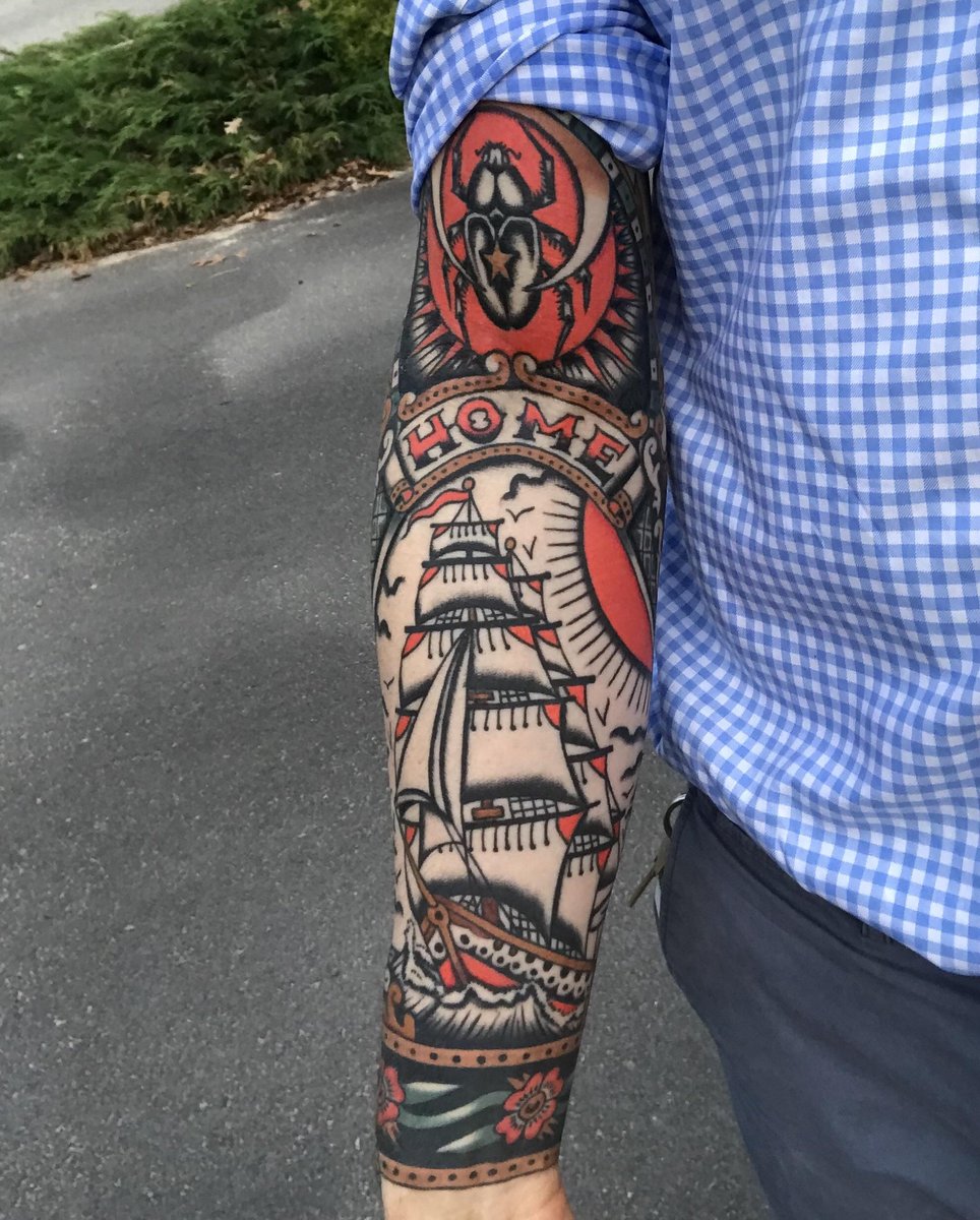 Photo of the tattoo titled Ship and Beetle's Journey