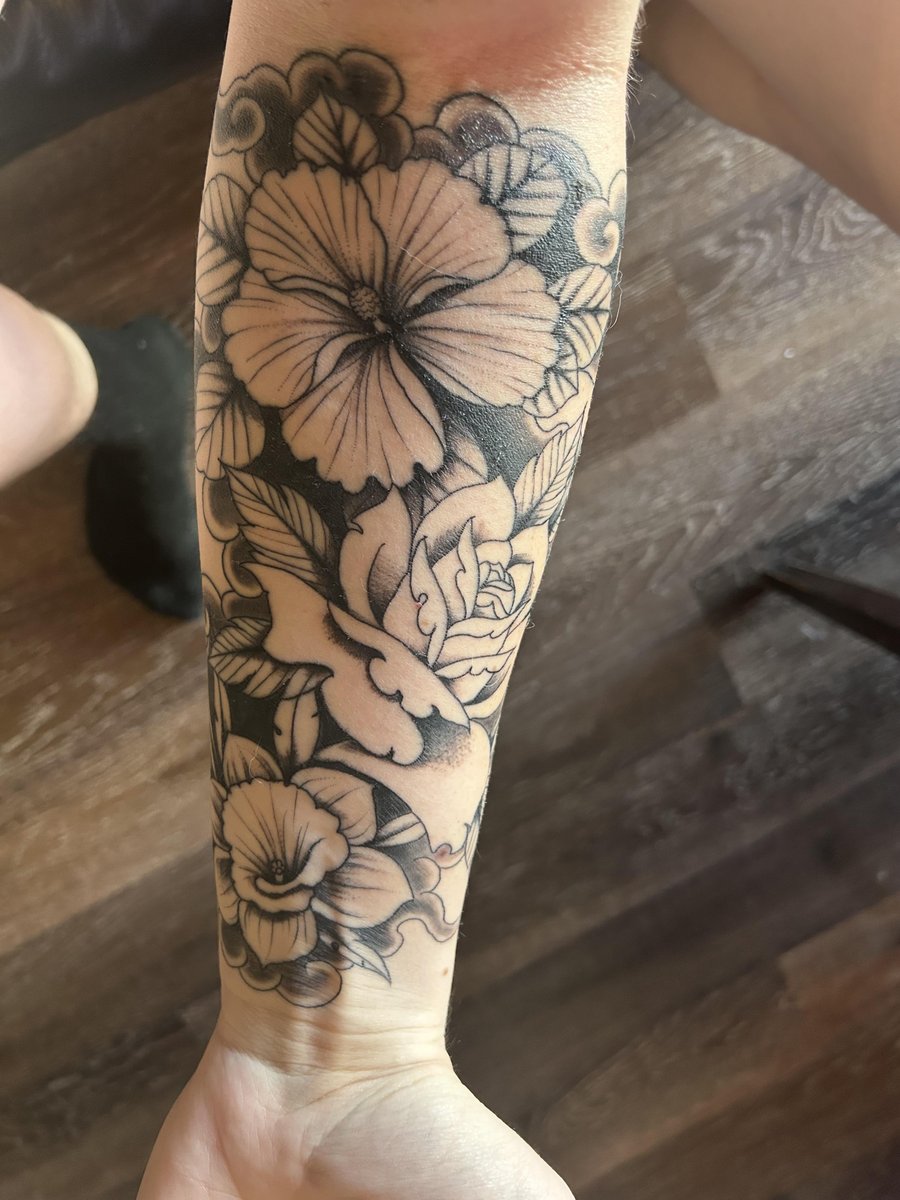 Photo of the tattoo titled Memorializing My Brother with Flowers