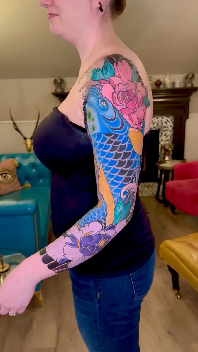 Photo of the tattoo titled Vibrant Blue Koi and Peony Sleeve