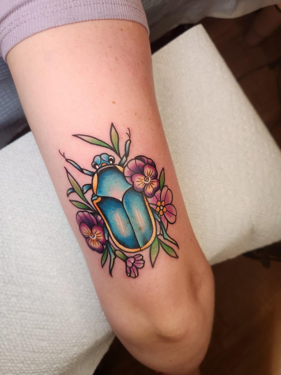 Photo of the tattoo titled Junebug and Birth Month Flowers