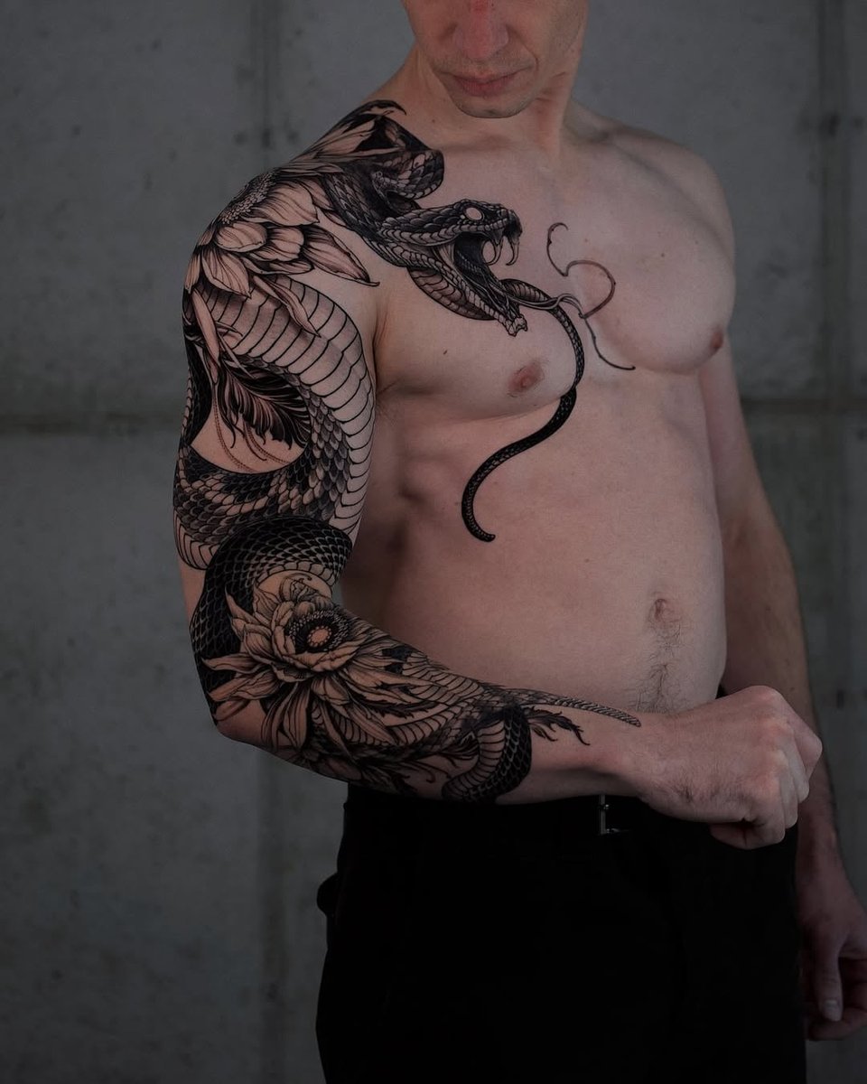 Photo of the tattoo titled Rattlesnake and Queen of the Night Line Work