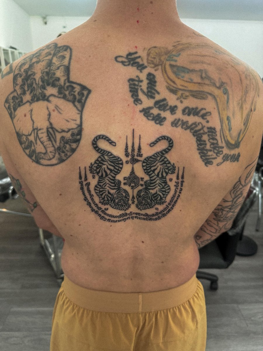 Photo of the tattoo titled Sak Yant Twin Tigers Honeymoon Tattoo