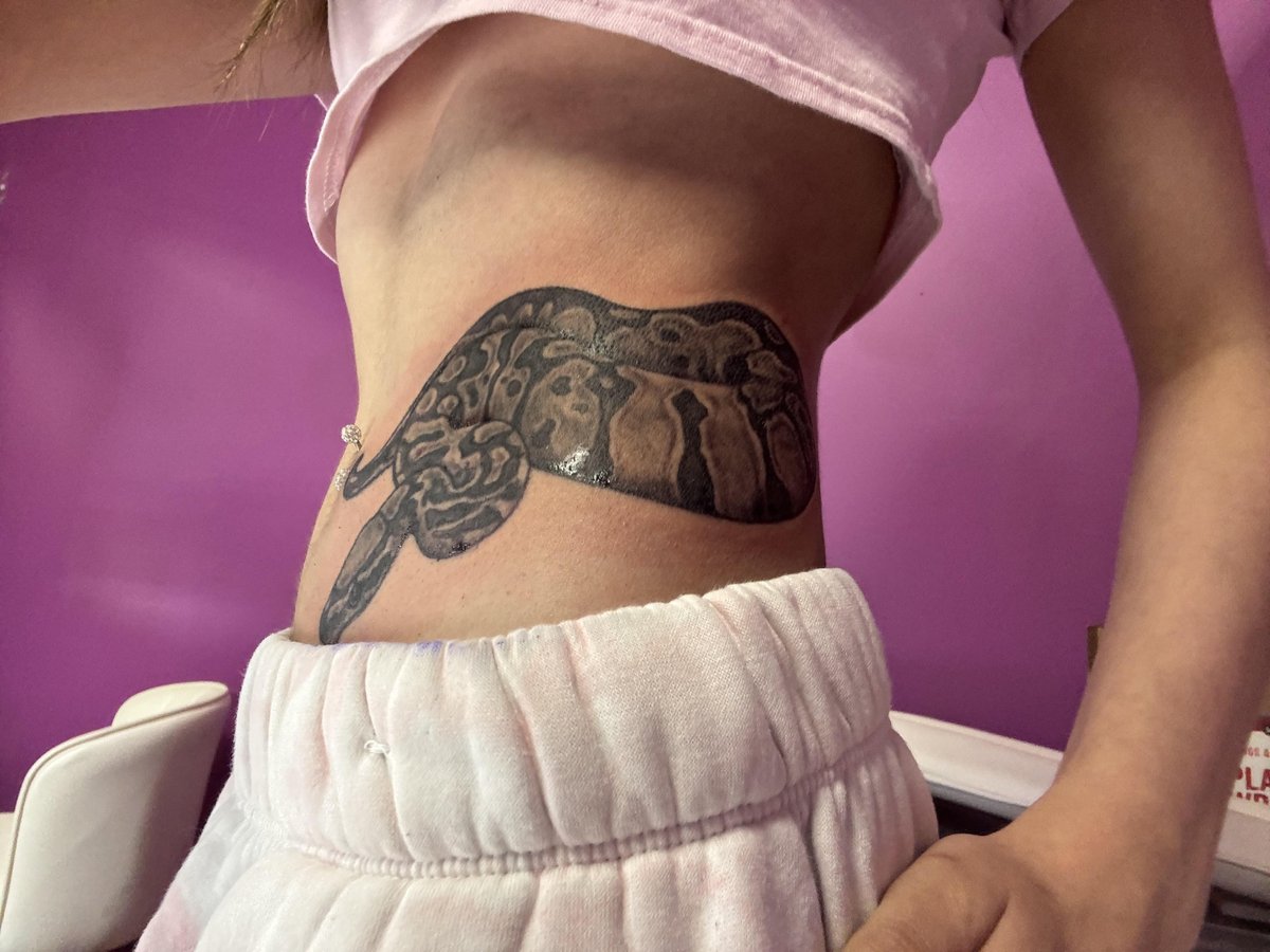 Photo of the tattoo titled Eight Years With My Python