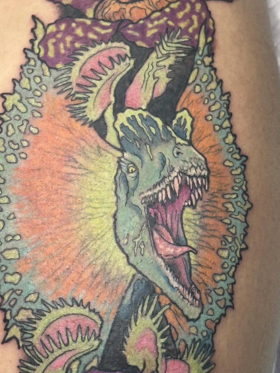 Photo of the tattoo titled Matching Dinosaur Tattoos