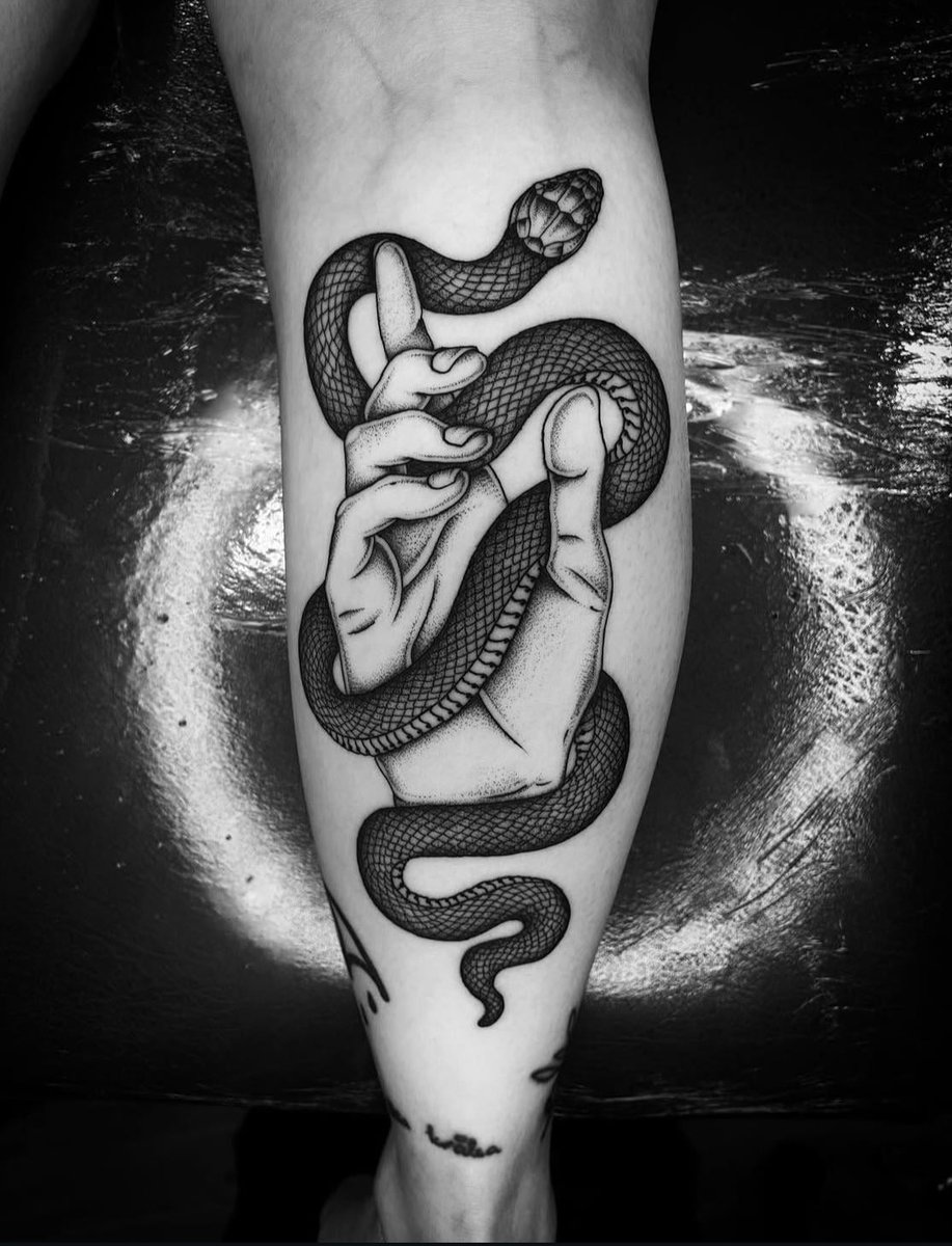 Photo of the tattoo titled Symbolic Hand and Snake