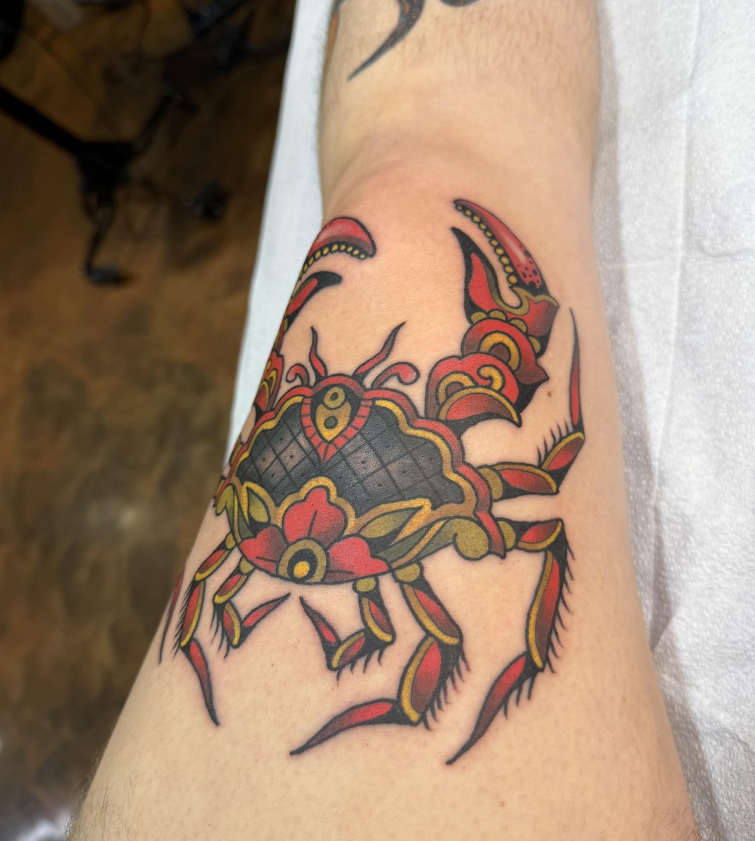 Photo of the tattoo titled My First Thigh and Knee Crab