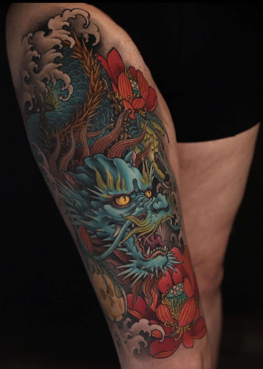 Photo of the tattoo titled Dragon, Skull, and Lotus Symbolism