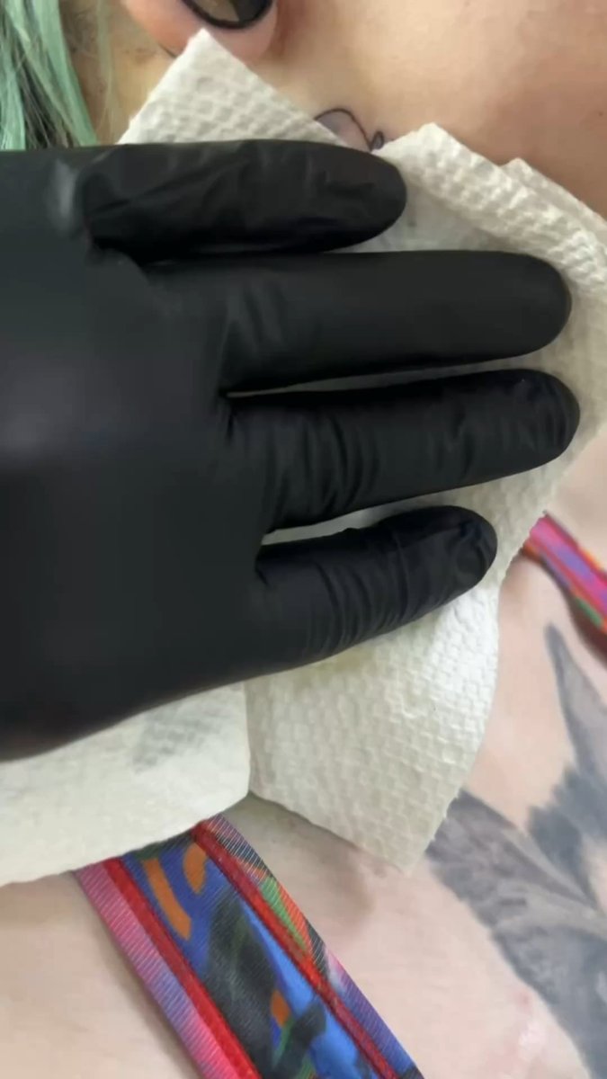 Photo of the tattoo titled Red Dead Kitty Neck Tattoos