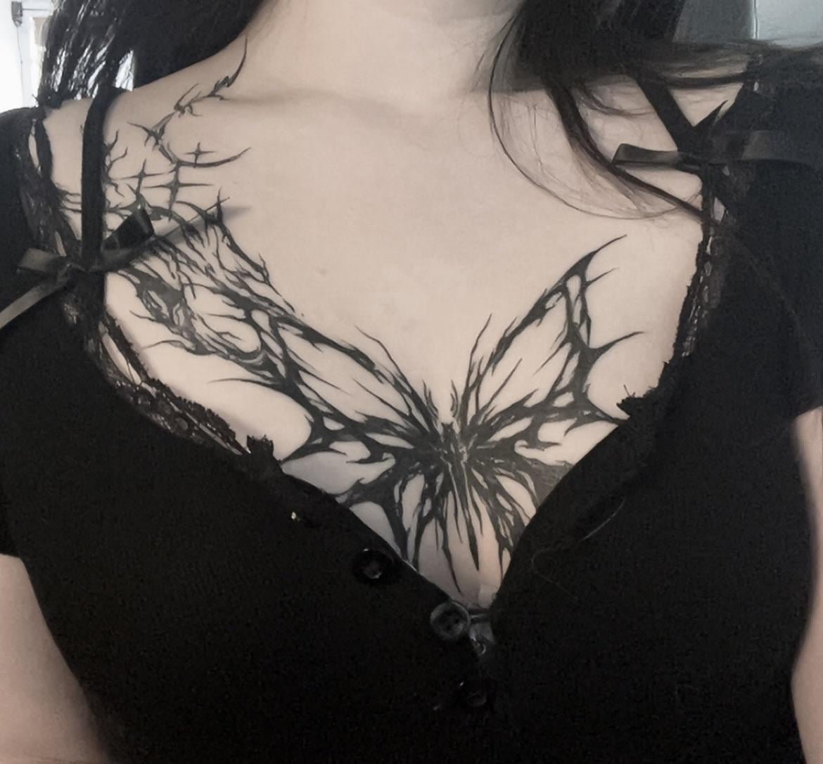 Photo of the tattoo titled Cybersigilistic Butterfly on Collarbone