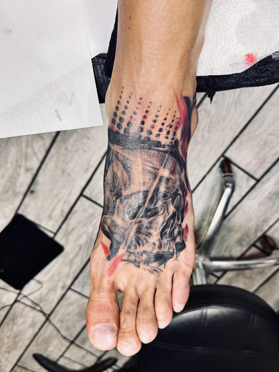 Photo of the tattoo titled Banksy Skull Foot Tattoo