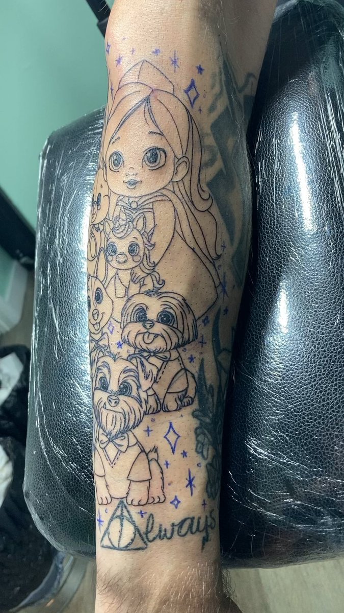 Photo of the tattoo titled Cartoon Daughters and Doggies