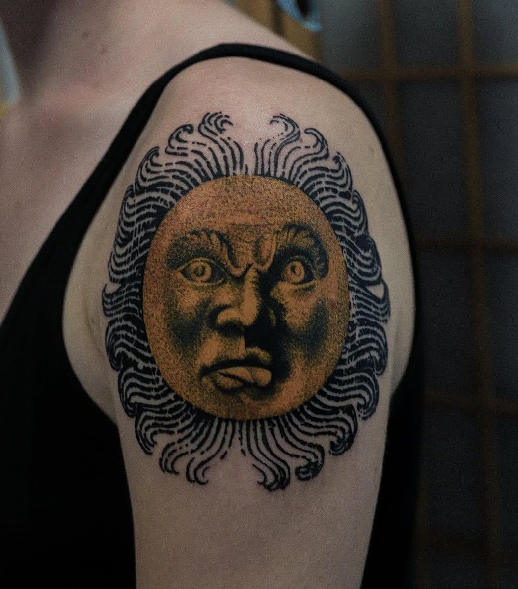 Photo of the tattoo titled Grotesque Sun Tattoo