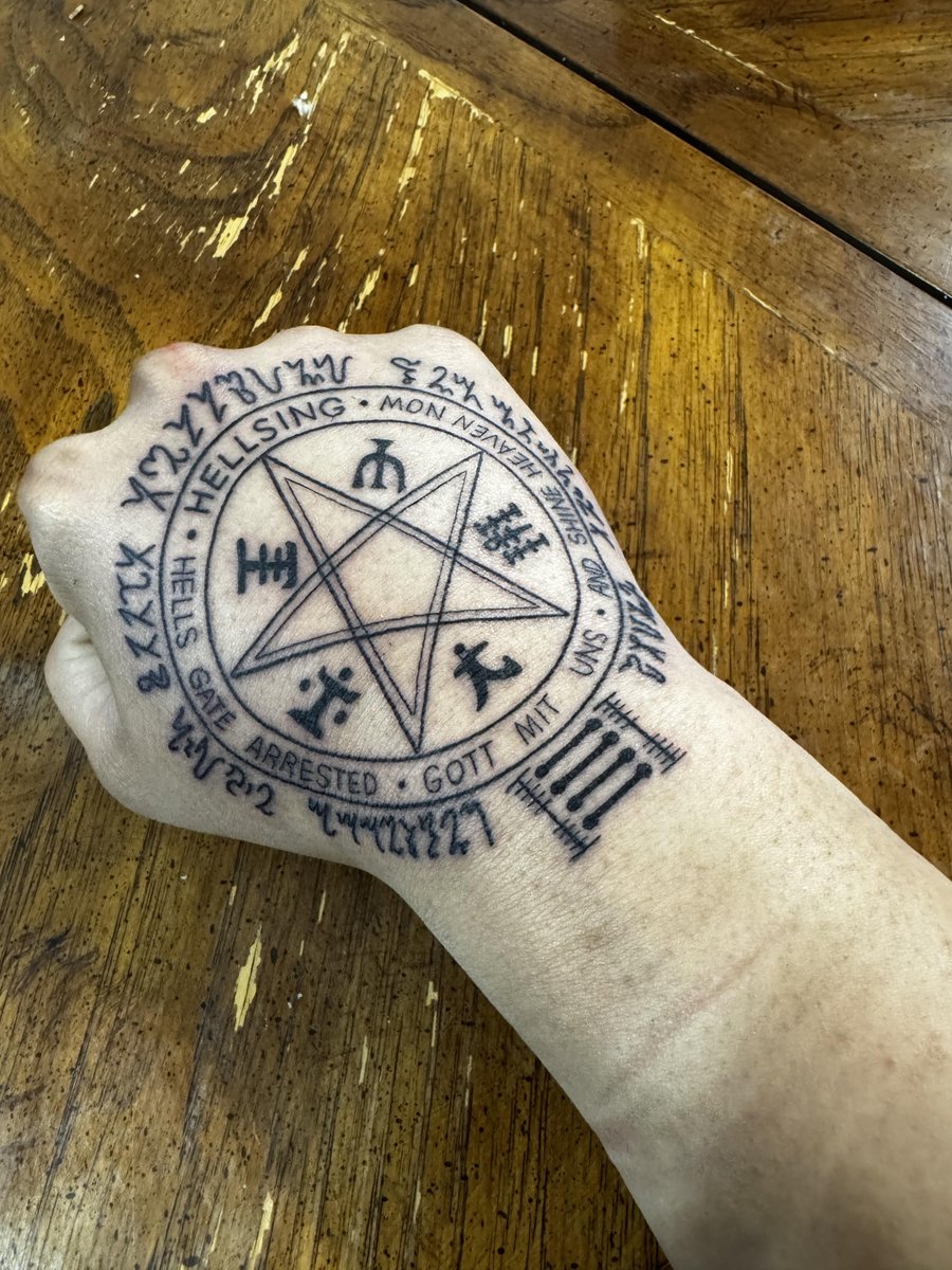 Photo of the tattoo titled Hellsing Family Seal Sleeve Progress