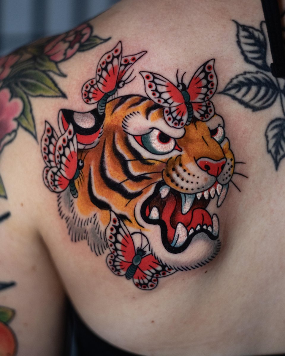 Photo of the tattoo titled Tiger and Butterflies Symbolism