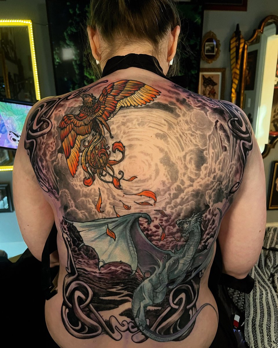 Photo of the tattoo titled Phoenix and Dragon's Journey Tattoo