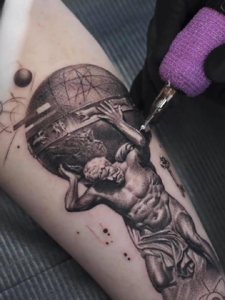 Photo of the tattoo titled Gravity Tattoo with Cosmic Flair